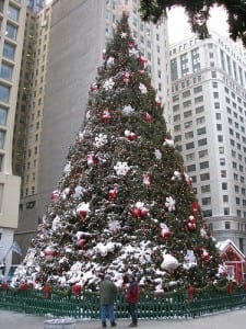 Holiday shoppers gazing at Christmas tree, but online shopping is better