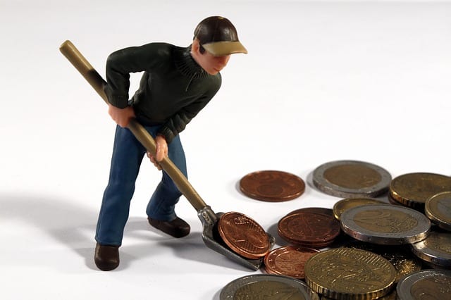 shoveling money