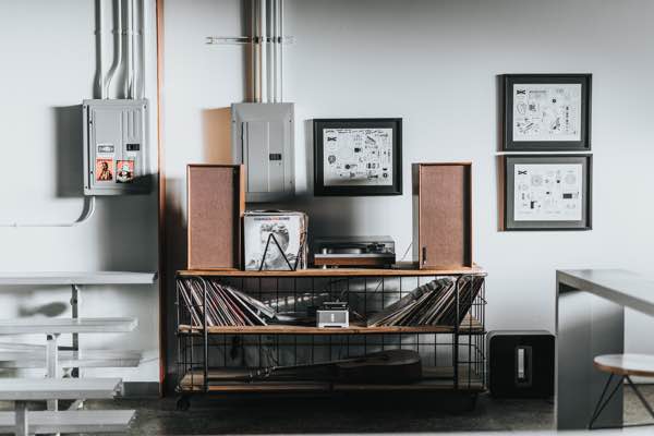 shelving system with a record player on it