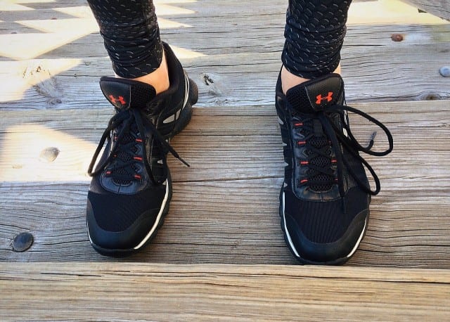 a woman in black running shoes, deals on running shoes