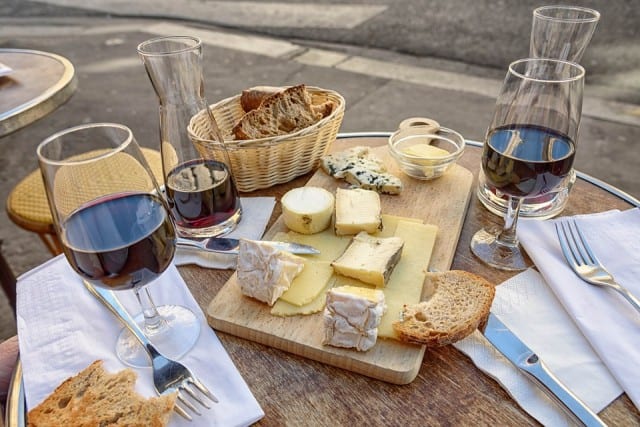 Wine in a glass and a cheese plate