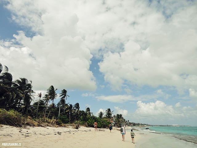 people walking on a Columbian beach