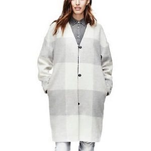 Women wearing a white and grey plaid Adam Lippes coat