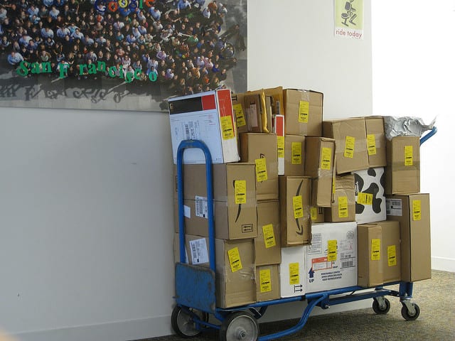 stack of packages waiting to be deliverd width=