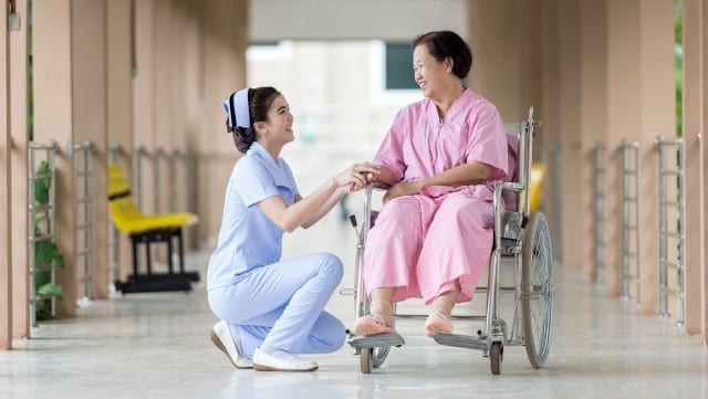 nurse helping patient