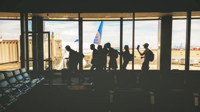 Group of friends waiting to board a plane