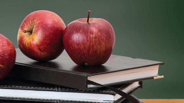 apples on a textbook