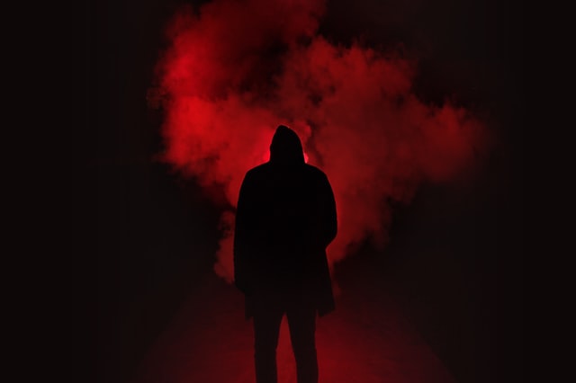 man in red smoke