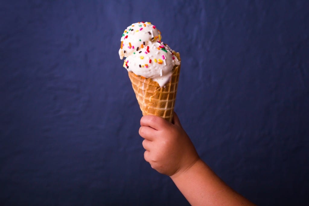 child holding an ice cream cone