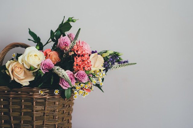 multi colored flowers in a basket