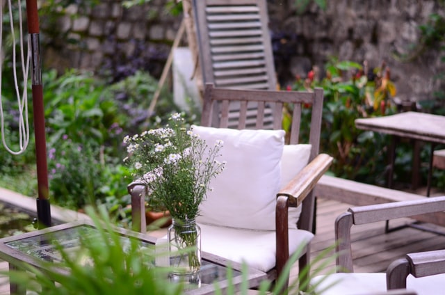 wood patio chair with white pillow